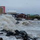 A wave washing up on the Inuvialuit hamlet of Tuktoyaktuk in Canada’s Northwest Territories during an August 2019 storm.